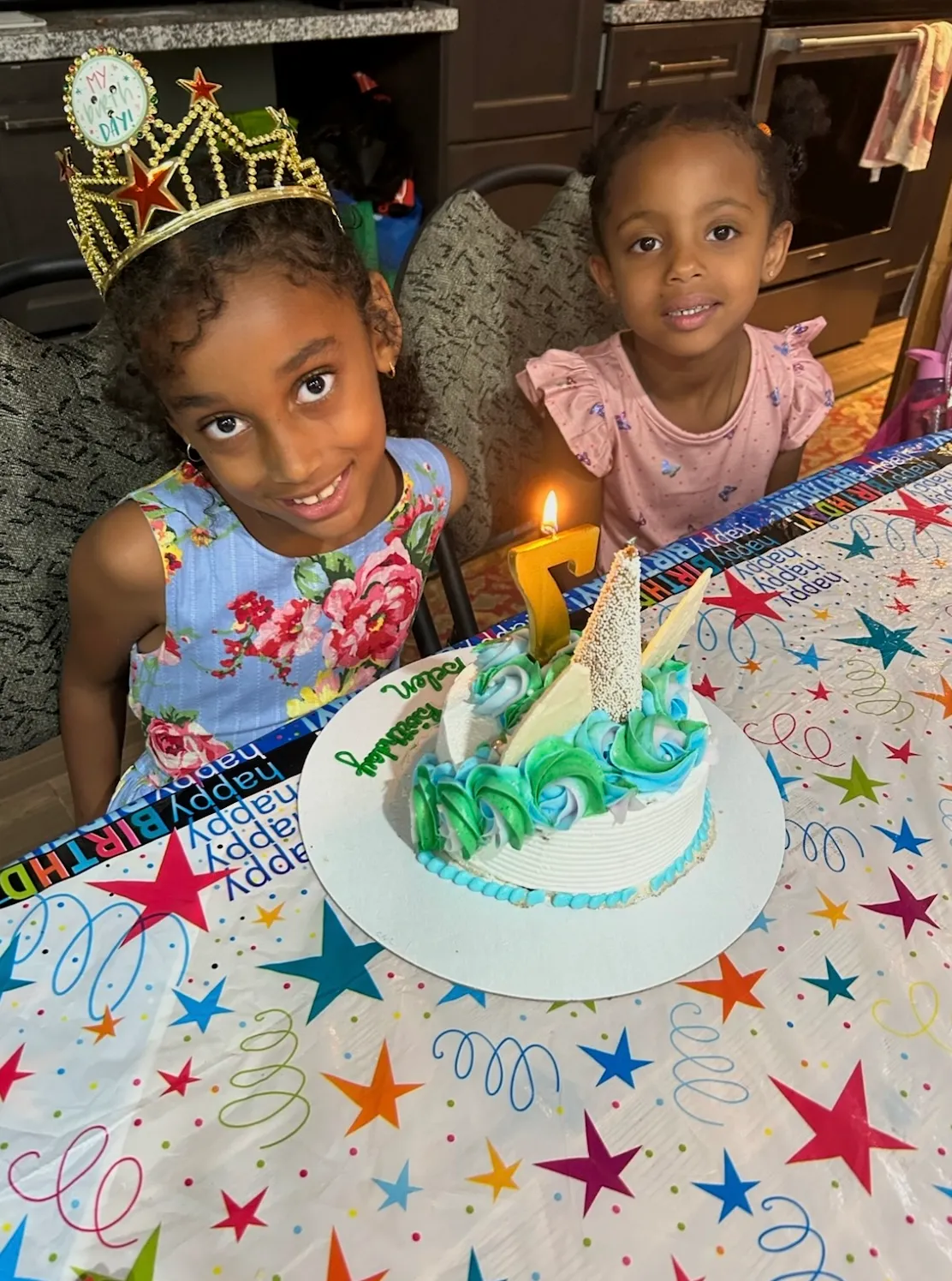Photo of daycare kid blowing birthday candles